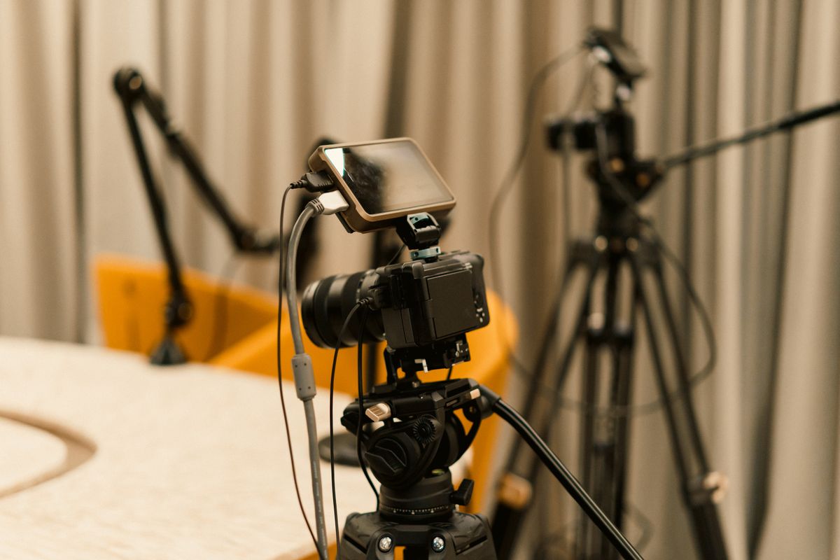 Cameras and microphones set up in a recording studio.